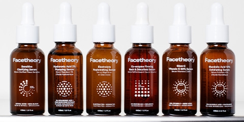 Brown bottles of Facetheory products, with white dropper tops