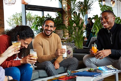 friends laughing over drinks