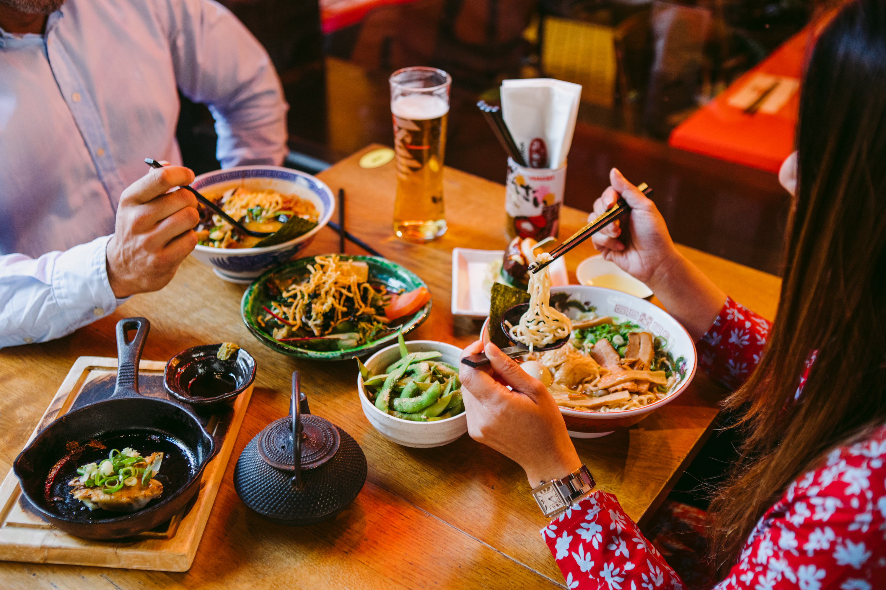 table of various bowls of asian food