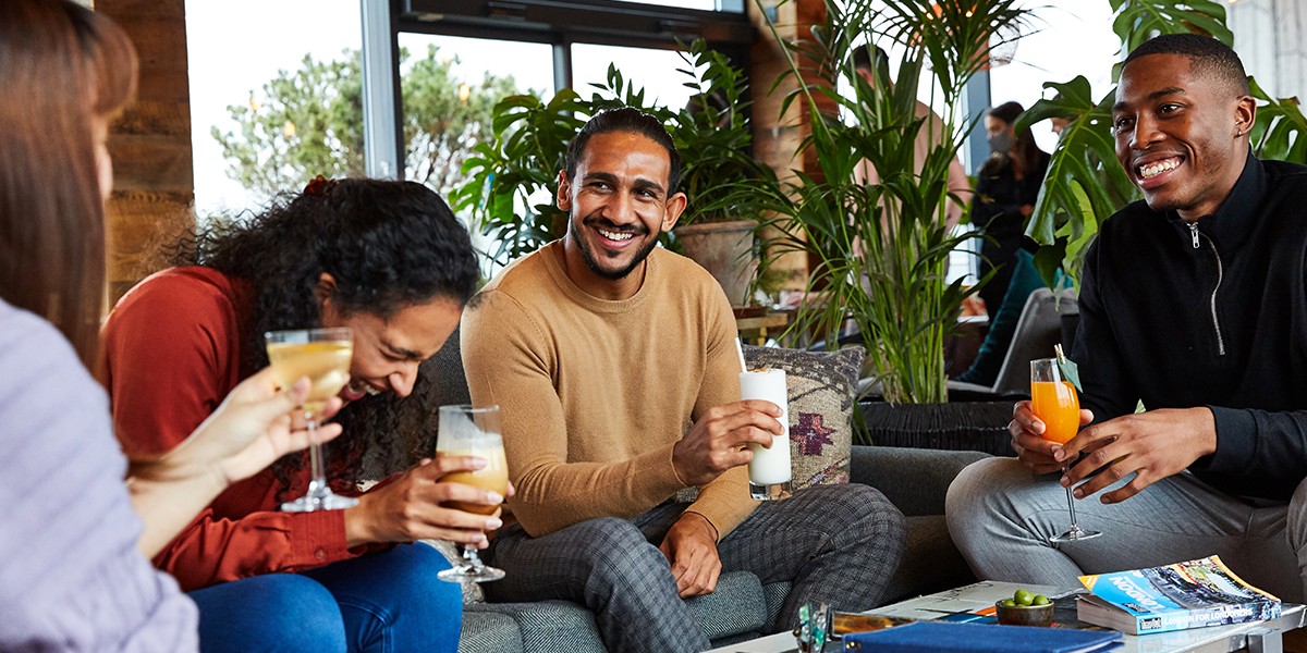 friends laughing over drinks